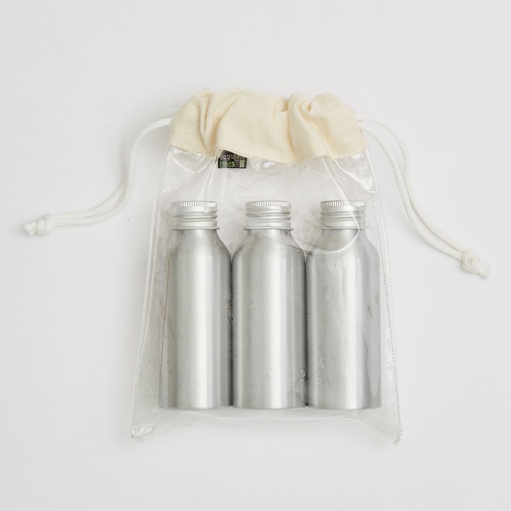 clear-pvc-small-drawstring-bag-with-metal-bottles PVC bag with polycord drawstrings tied with end-knots - Ethical Manufacturer